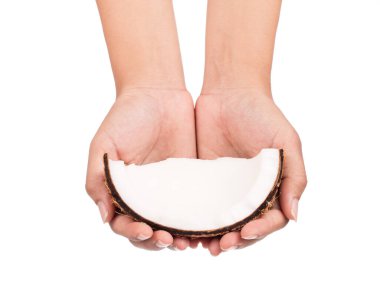 Hindistan cevizi tutarken Eski kahverengi beyaz arka planda izole