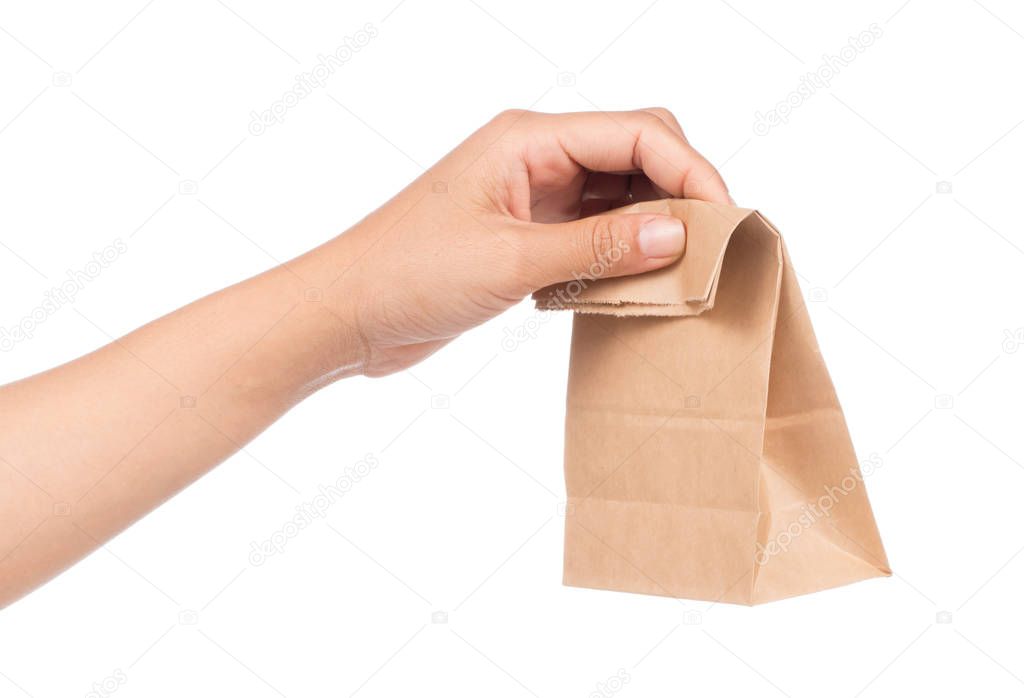 hand holding paper bag isolated on white background