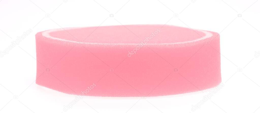 Pink sponge isolated on white background.