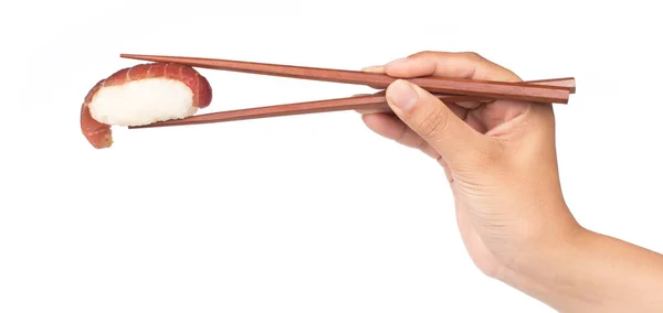 Mão Segurando Sushi Salmão Com Pauzinhos Isolados Fundo Branco — Fotografia de Stock