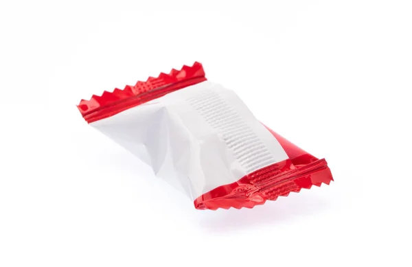 Beyaz Arka Planda Izole Edilmiş Plastik Poşetteki Çikolata Şekerlemeleri — Stok fotoğraf