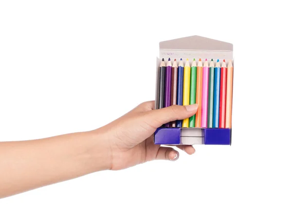 手に持つ白い背景に隔離された色鉛筆 — ストック写真
