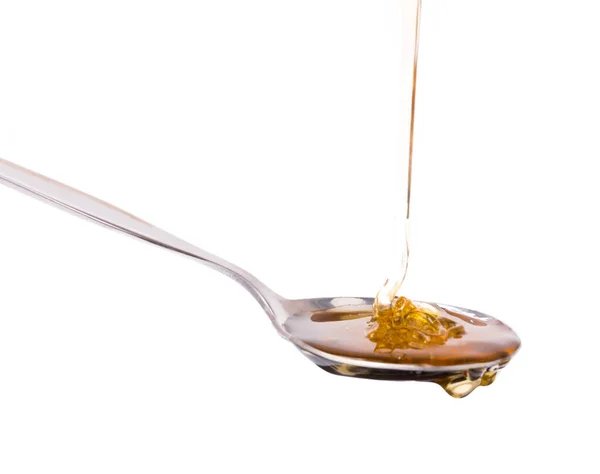 Honig Tropft Aus Einem Löffel Isoliert Auf Weißem Hintergrund — Stockfoto