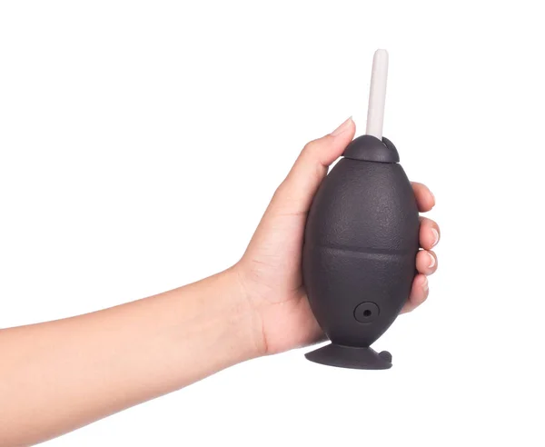 hand holding Silicone blower or Rubber Air Blower Pump Dust Cleaner for camera and lenses on white background.