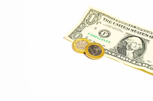 白い背景に1ポンドと1ユーロ硬貨と1ドル紙幣 — ストック写真
