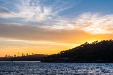 Backlight skyline of Sydney CBD from the bay at sunset
