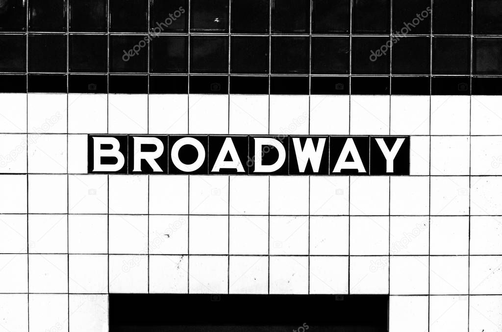 Broadway subway stop sign made of tiles opposite the platform