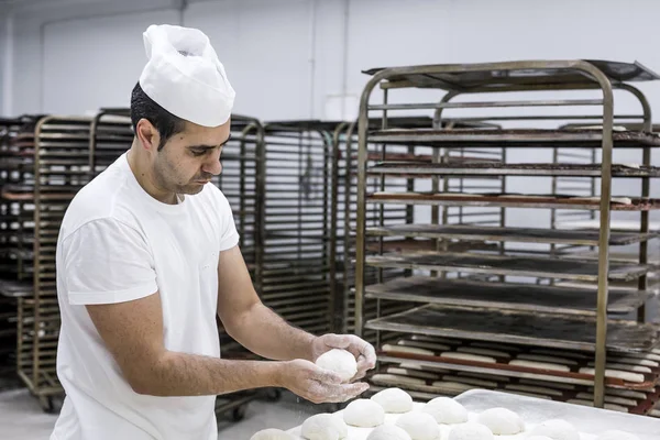 Baker kneading bread