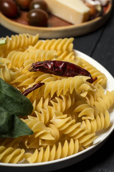 Raw italian pasta with ingredients — Stock Photo, Image
