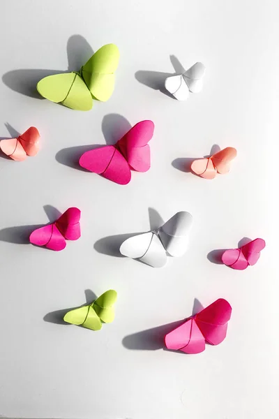 Multi-colored origami butterflies from above — Stock Photo, Image