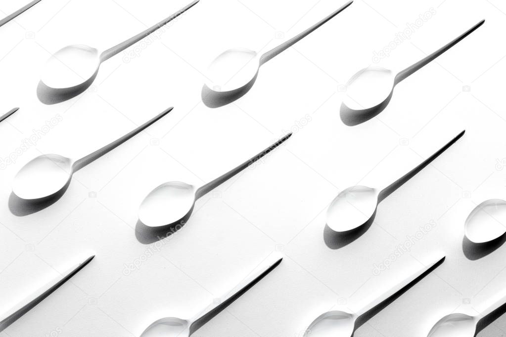 Flat lay photo of white plastic spoons