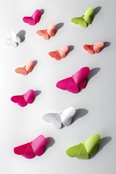 Multi-colored origami butterflies from above — Stock Photo, Image