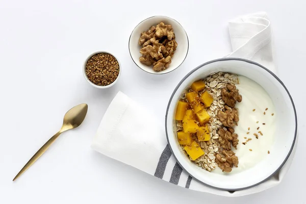 Bowl of homemade granola with yogurt and cereals