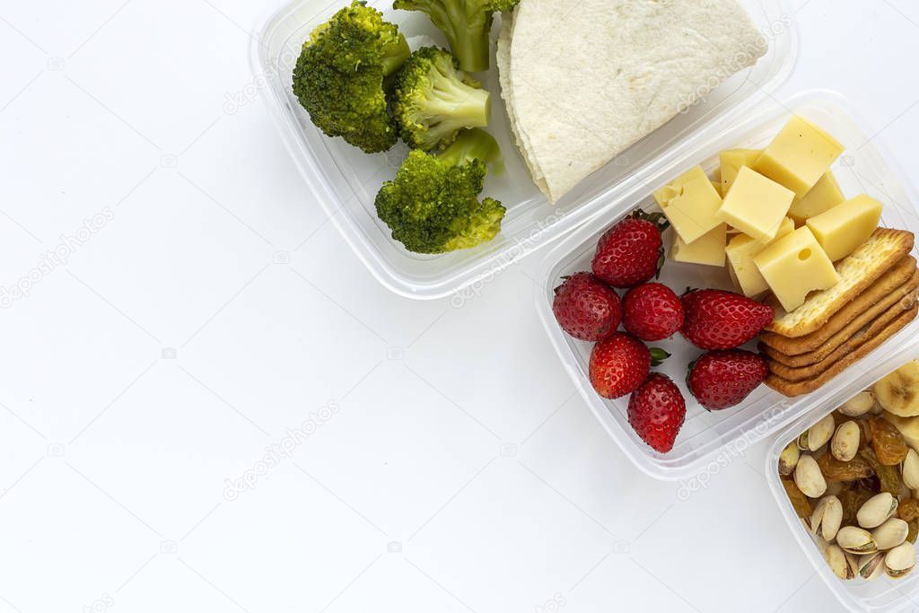 Food in Plastic containers ready to eat from above To take away. On white background. Healthy food. Isolated. Flat lay