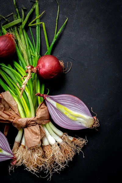 Fresh red and white onions on dark background.Vegan food.Food Ingredient