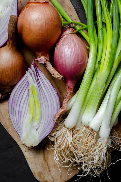 Fresh red and white onions on dark background.Vegan food.Food Ingredient