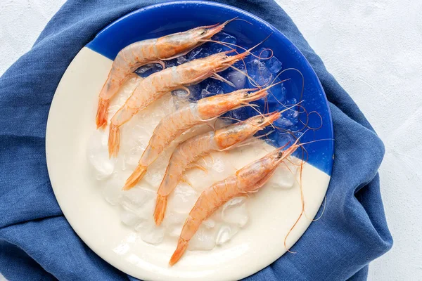 Fresh raw prawns prepared for cooking.From above on white background.Flat lay.Top view