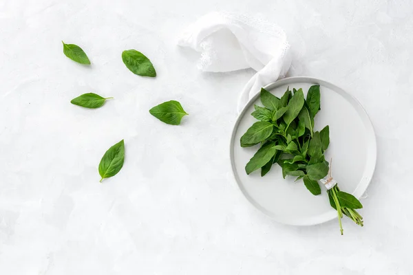 Assortment of fresh aromatic herbs from above on white background. Parsley, Mint, Thyme, Basil, Oregano, Rosemary, Chives and estragon.Flat lay.Top view