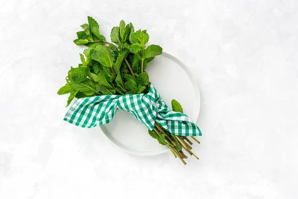 Assortment of fresh aromatic herbs from above on white background. Parsley, Mint, Thyme, Basil, Oregano, Rosemary, Chives and estragon.Flat lay.Top view