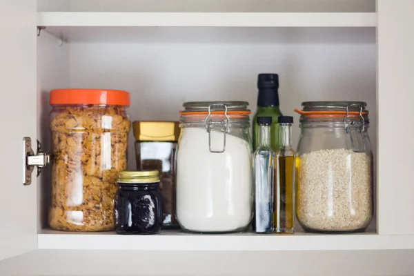 Food cupboard, pantry with jars — Stock Photo, Image