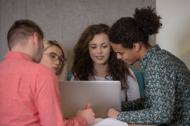 Group of college students smiling happily making a selfie together