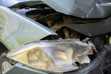 Auto accident involving two cars on a city street - Image