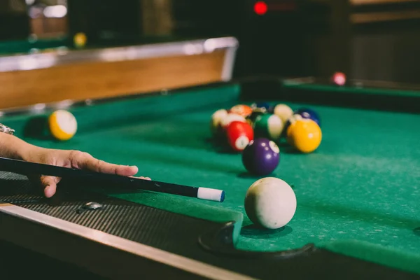 Sports game of billiards on a green cloth. Billiard balls with numbers on a pool table. Billiards team sport. — 스톡 사진