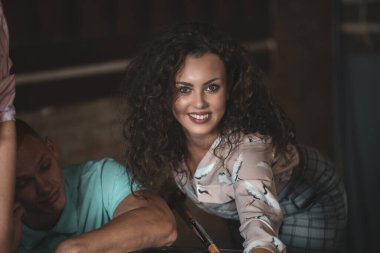 Young people playing snooker