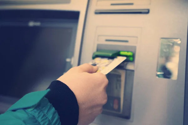 the girl raises money from the ATM - Image