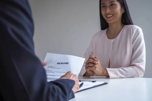 Closeup resume paper with qualifications on the desk during job interview  in the office with young applicant candidates and interviewer, discussing  on Stock Photo - Alamy