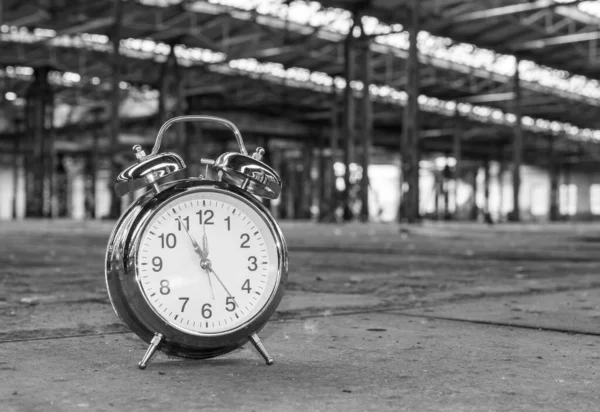 Clock in factory background — Stock Photo, Image