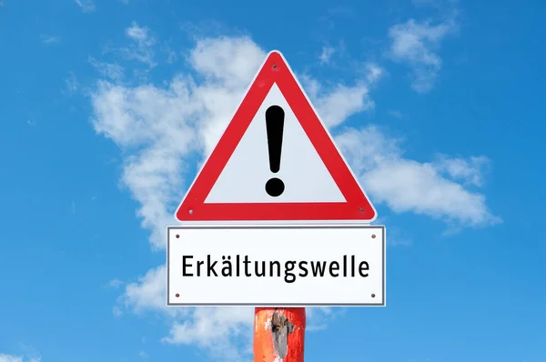 Warnsign Erkaeltungswelle v němčině — Stock fotografie