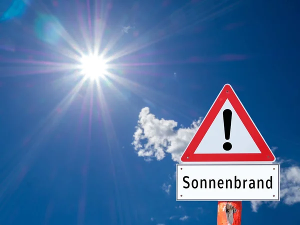 Warning sign sunburn in german — 스톡 사진
