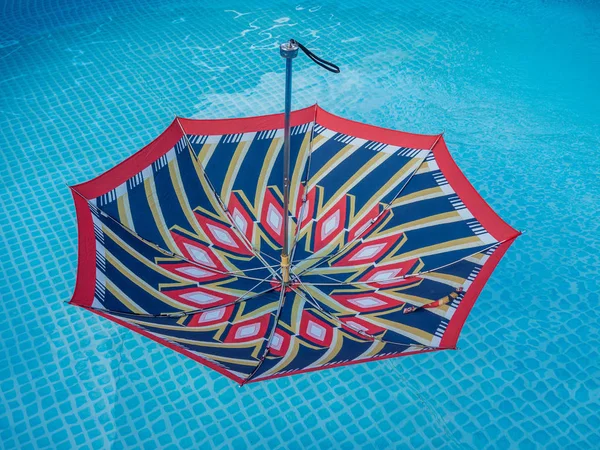 Umbrella in the water — Stock Photo, Image