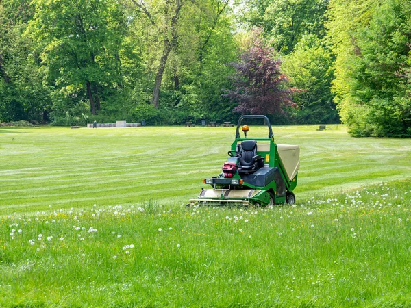 Lawn tractor in green maintenance