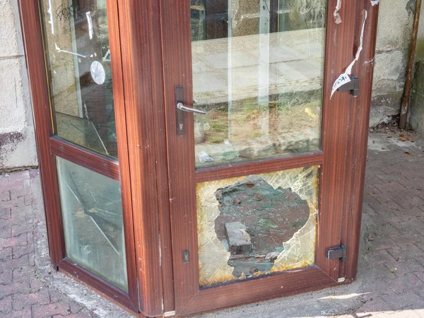 broken shop door after a break-in