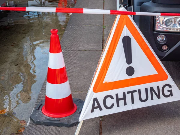 Attention shield Warning Sign in German — Stok fotoğraf