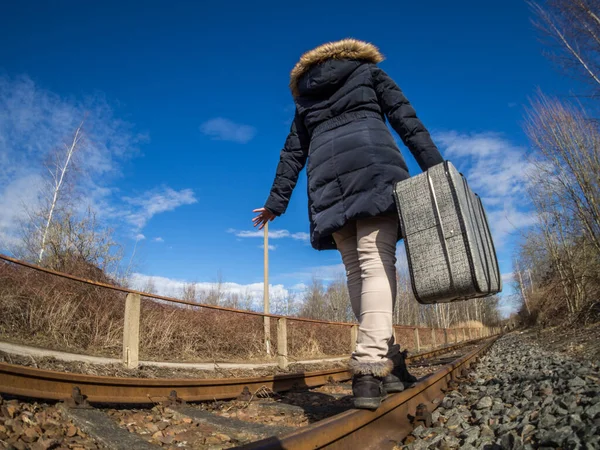Girl walking on railroad — Stock Photo, Image