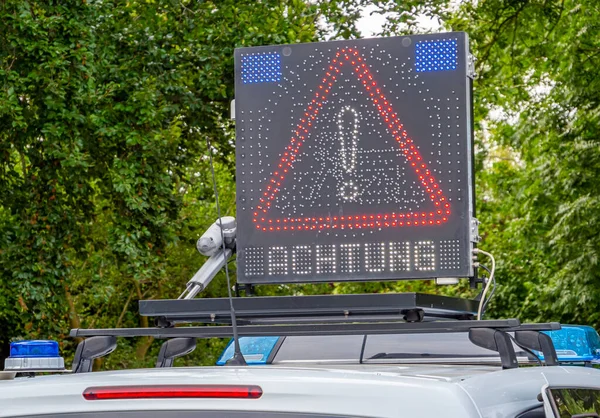 Attention police warning sign traffic accident in german — Stok fotoğraf