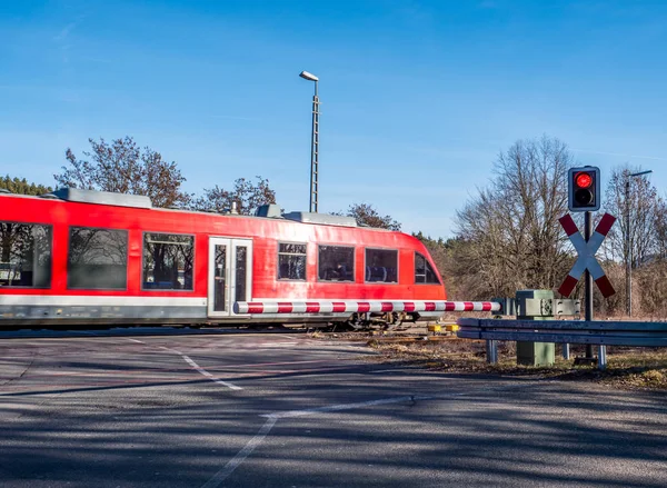 Train at a railroad crossing — Stok fotoğraf