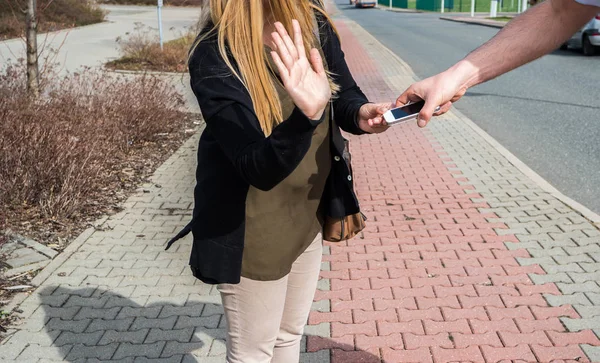 Theft catching mobile from women hand — Stockfoto