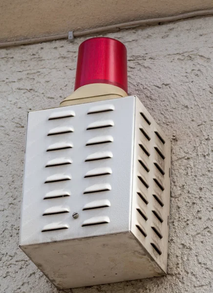 burglar alarm system red light on the house