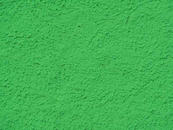 Gesso texturizado verde em uma parede — Fotografia de Stock