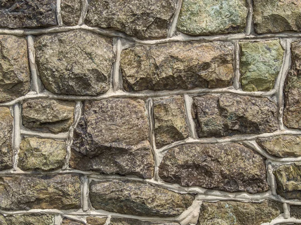 Oude grijze natuurstenen muur — Stockfoto