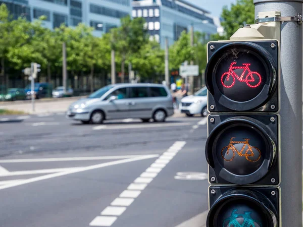 Bicycle traffic light points to red in traffic