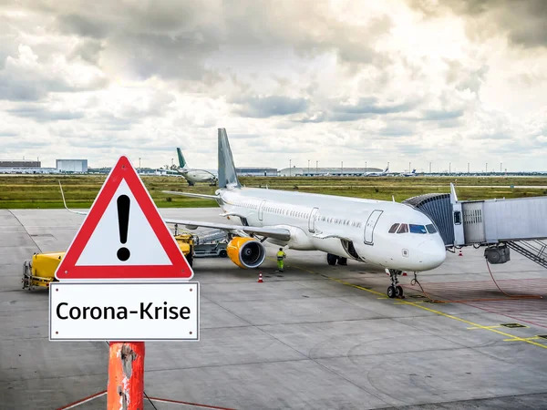 Corona crisis aviation warning sign in german