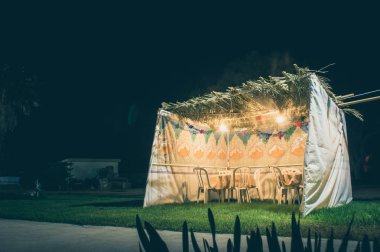 Sukkah - symbolic temporary hut for celebration of Jewish Holiday Sukkot clipart