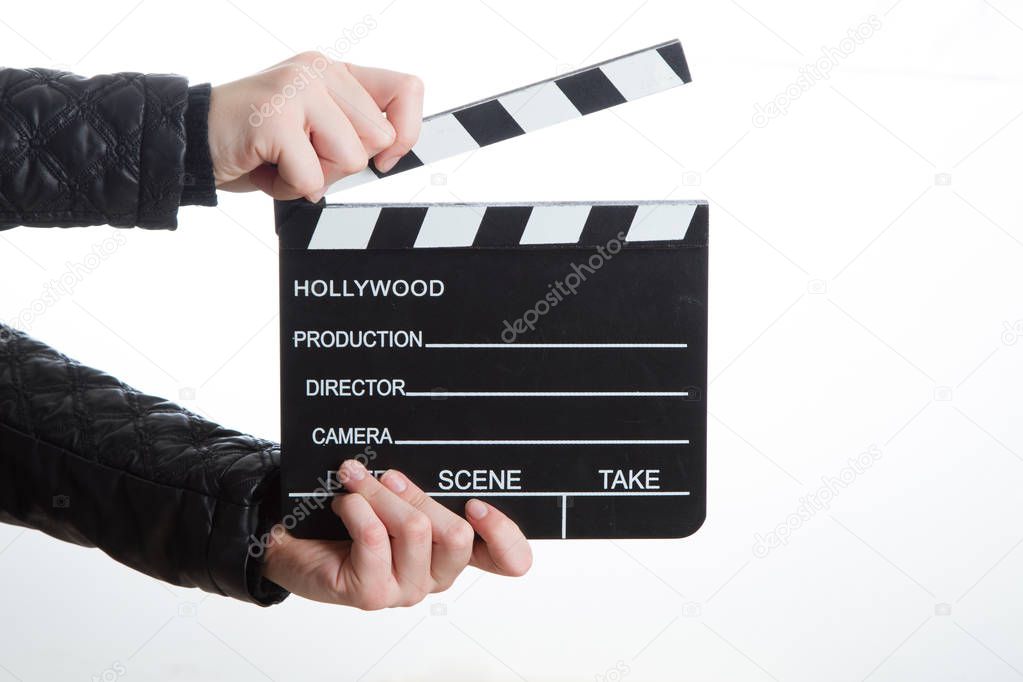 Hands holding clapperboard