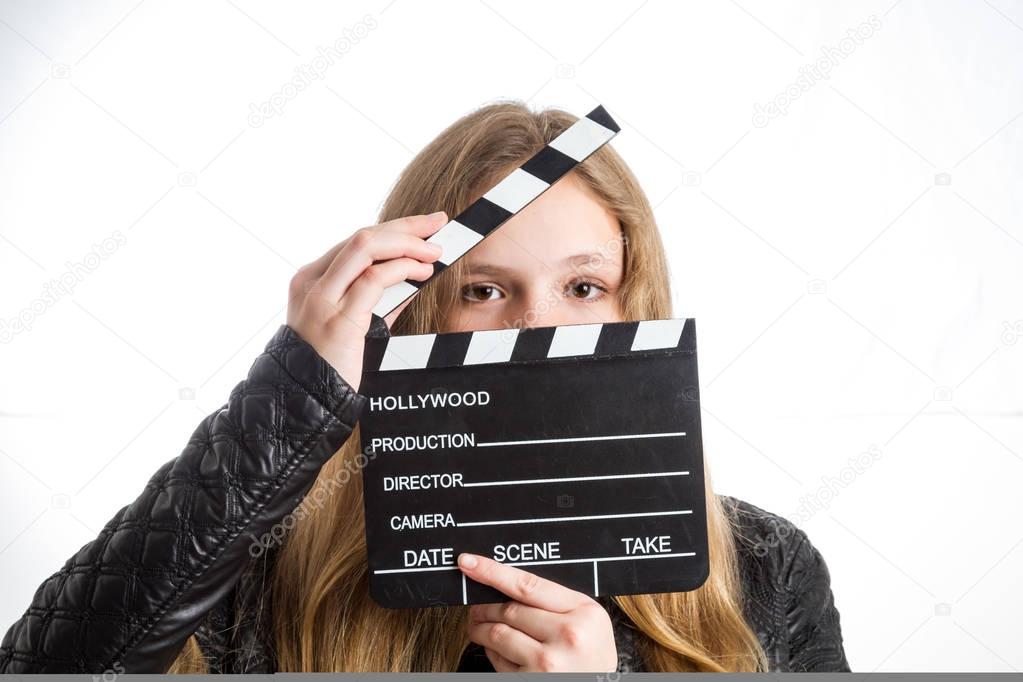 Teenage girl with clapperboard
