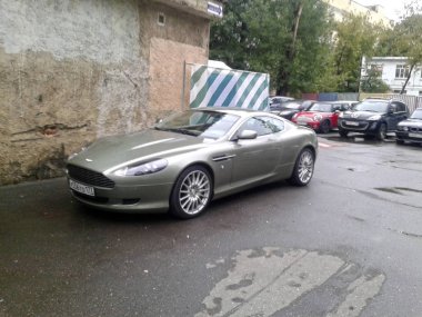 Aston Martin DB9 in the Moscow courtyard. September 2017. clipart